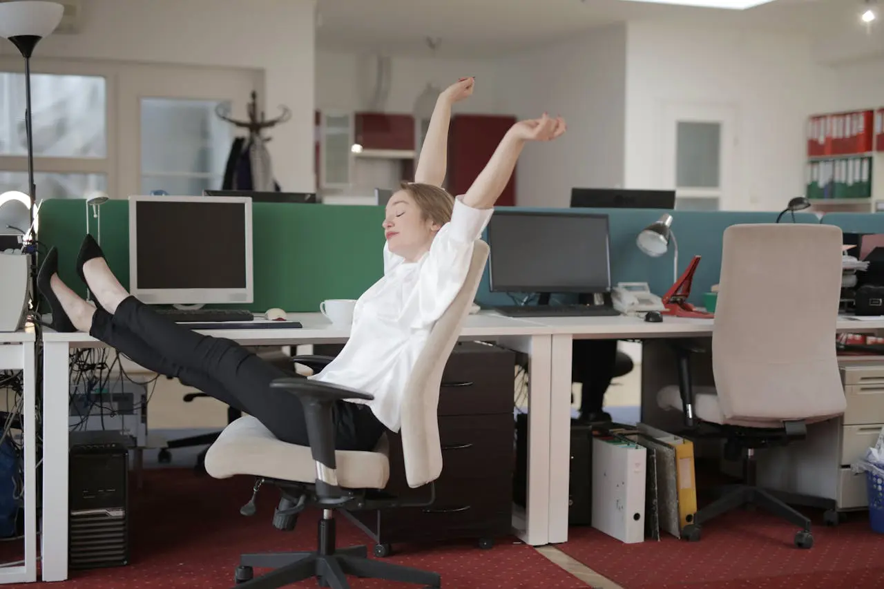 a woman doing big stretches in an office